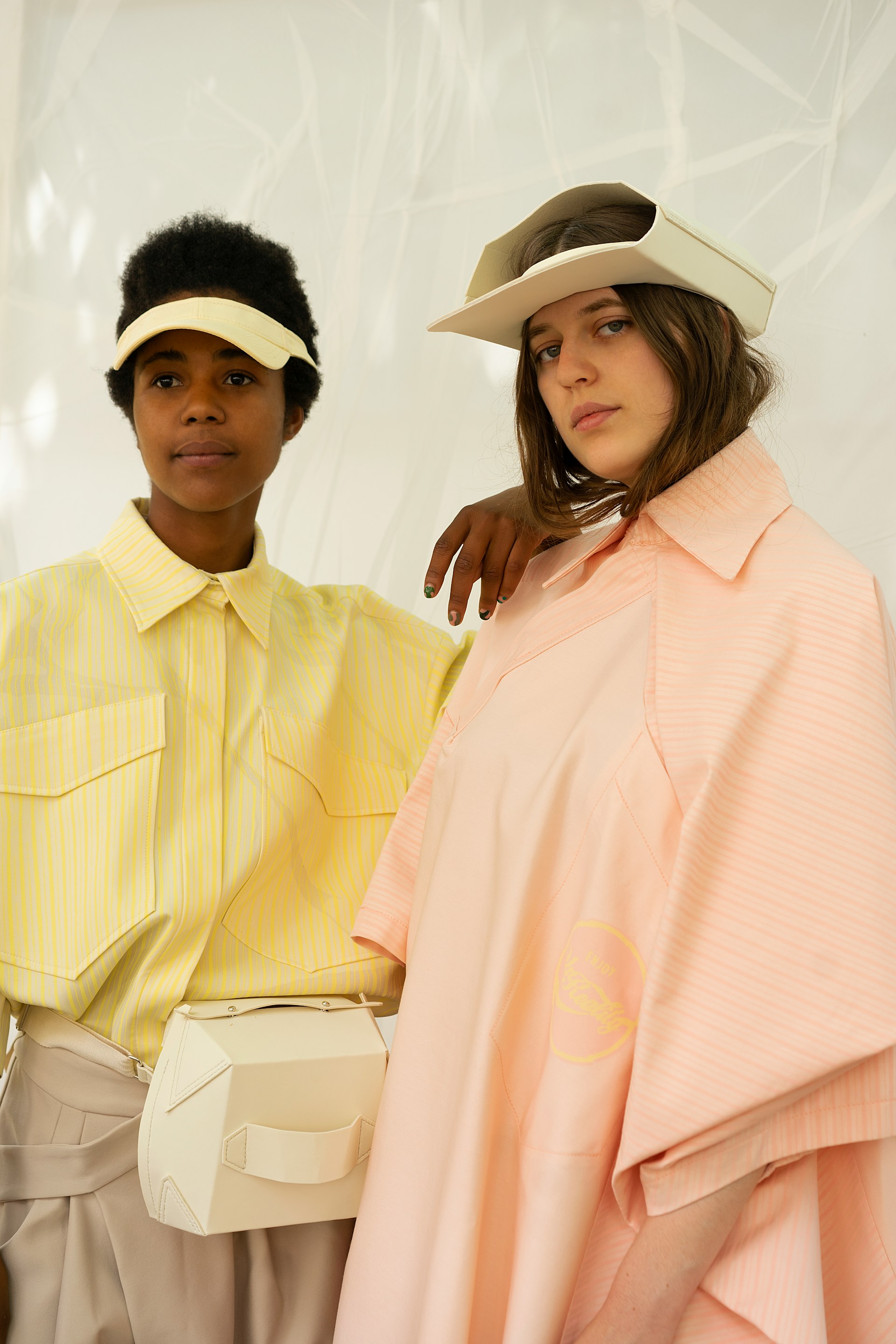 2 women wearing pastel colors