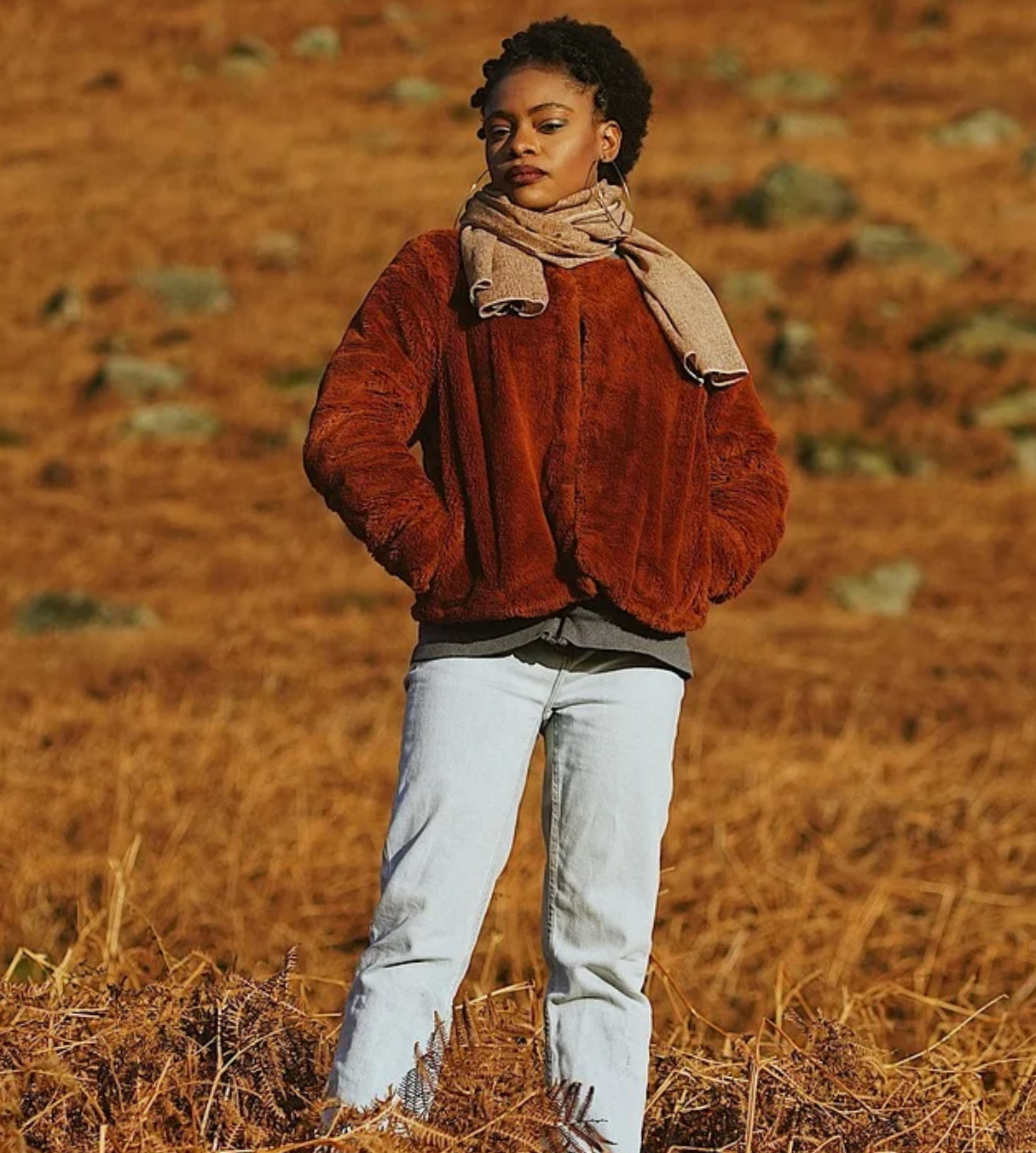 a woman on dry land wearing casual winter clothes