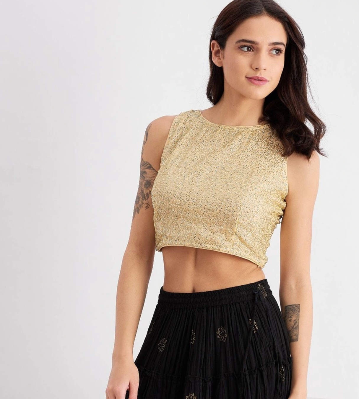 a woman wearing beige top